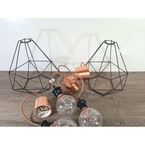 500 - Three lighting items, one Ikea copper effect three bulb pendant light and two black metal geometric ... 