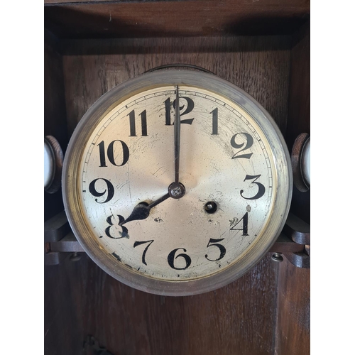 503 - A mid 20th century oak cased chiming wall clock with pendulum - approx. 78cm high x 33cm wide x 16cm... 