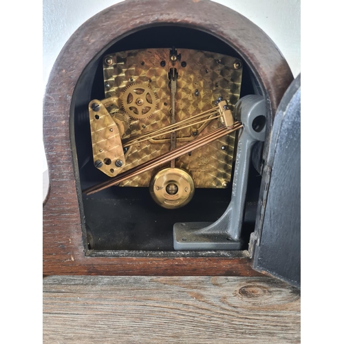 504 - A Garrard oak cased chiming mantel clock with pendulum - approx. 21.5cm high x 33cm wide x 15cm deep