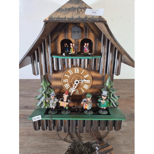 506 - A mid 20th century German Die Mühle Im Schwarzwald wooden cuckoo clock with pendulum and weights - a... 