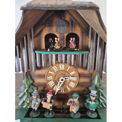 506 - A mid 20th century German Die Mühle Im Schwarzwald wooden cuckoo clock with pendulum and weights - a... 