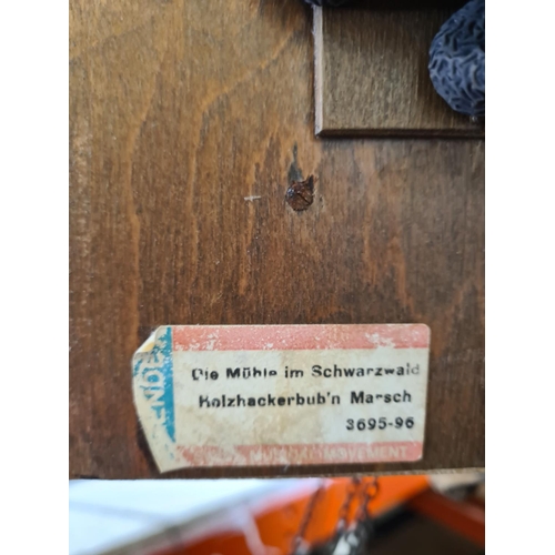 506 - A mid 20th century German Die Mühle Im Schwarzwald wooden cuckoo clock with pendulum and weights - a... 