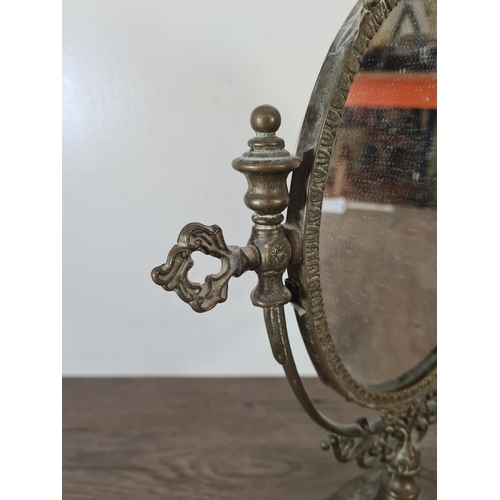 513 - A 19th century style brass toilet mirror - approx. 39cm high x 30cm wide