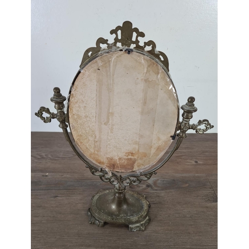 513 - A 19th century style brass toilet mirror - approx. 39cm high x 30cm wide