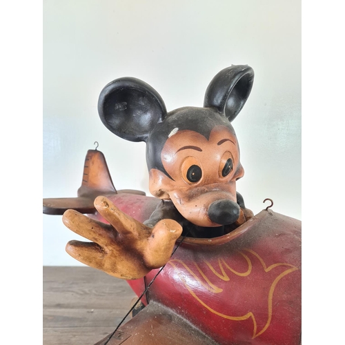 515 - A hand painted fibre glass model Mickey Mouse flying plane - approx. 53cm high