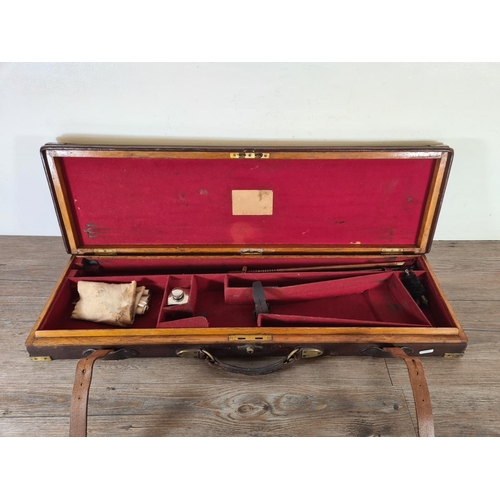 524 - A late 19th/early 20th century leather and brass gun case - approx. 9cm high x 84cm wide x 25cm deep