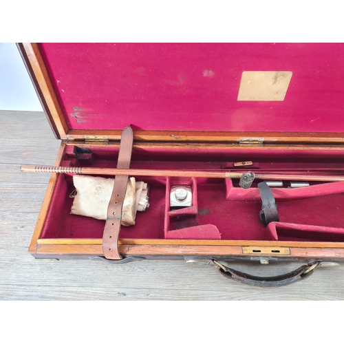 524 - A late 19th/early 20th century leather and brass gun case - approx. 9cm high x 84cm wide x 25cm deep