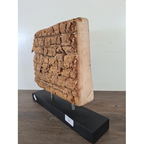 526 - A natural petrified wood slice mounted on plinth - approx. 30cm high x 36cm wide x 7.5cm deep