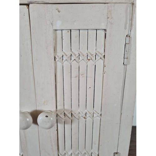 531 - A modern white painted wooden two door cabinet - approx. 44cm high x 35cm wide x 20cm deep