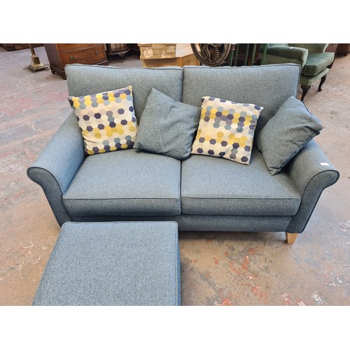 85 - An Alstons Upholstery Ltd. Poppy blue fabric upholstered two seater sofa with scatter cushion and ma... 