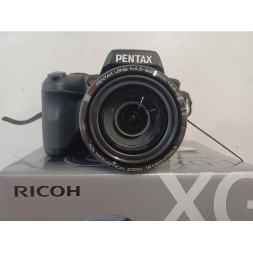 643 - A boxed Ricoh Pentax XG-1 super zoom compact digital camera