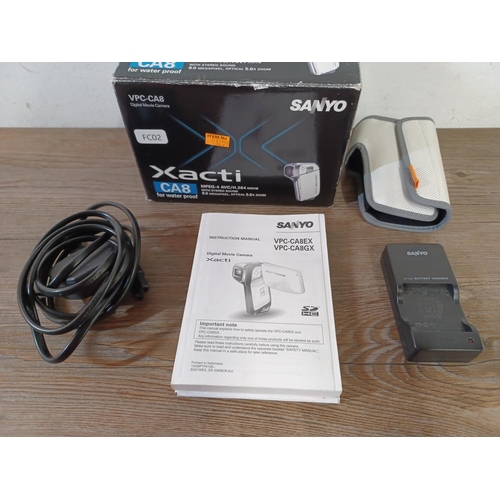 653 - A boxed and cased Sanyo Xacti VPC-CA8 waterproof to 15m 8mp digital camcorder with instruction manua... 