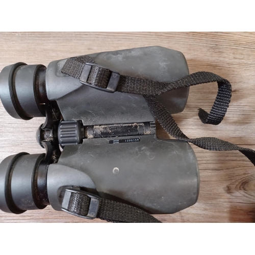 657 - Three pairs of binoculars to include cased Canon 8 x 32 WP 7.5° etc.