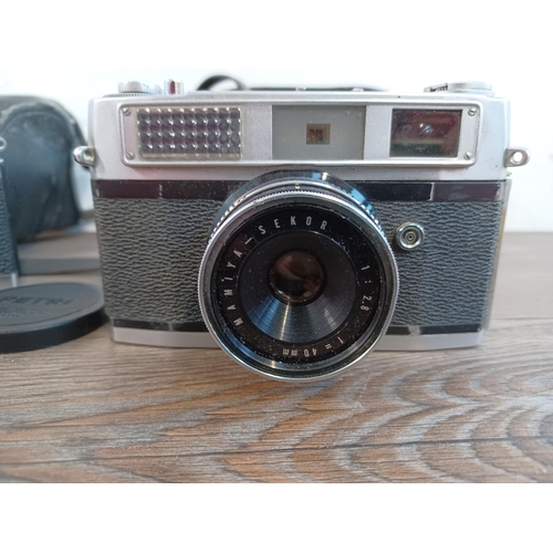 663 - Two cased Japanese 35mm rangefinder cameras, one 1970s Petri 7s II and one 1960s Rank Mamiya (Ruby/4... 