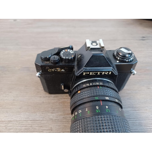 664 - Two 35mm SLR cameras, one cased KMZ Zenit-E and one Petri CT-1A fitted with Petri 35-70mm 1:3.5-4.5 ... 