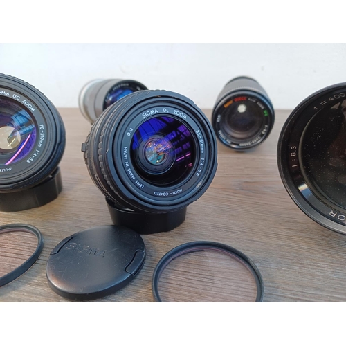 668 - Five camera lenses, one Sigma 70-210mm 1:4-5.6 UC zoom for Canon AF, one Sigma 35-80mm 1:4-5.6 DL zo... 