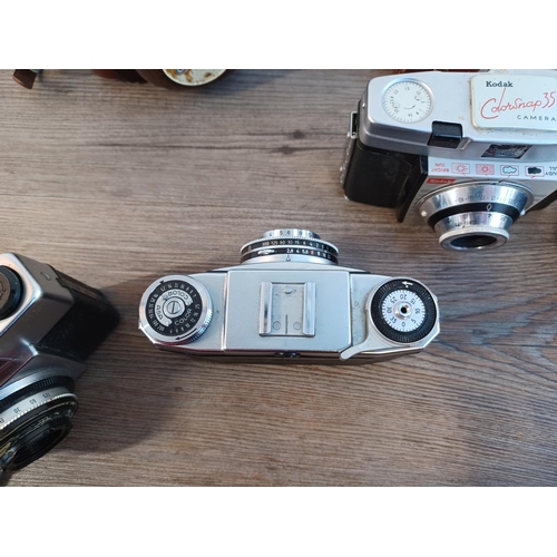 669 - Five 35mm cameras to include cased mid 1950s Zeiss Ikon Contina Ib fitted with Novicar-Anastigmat 1:... 