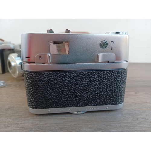 669 - Five 35mm cameras to include cased mid 1950s Zeiss Ikon Contina Ib fitted with Novicar-Anastigmat 1:... 