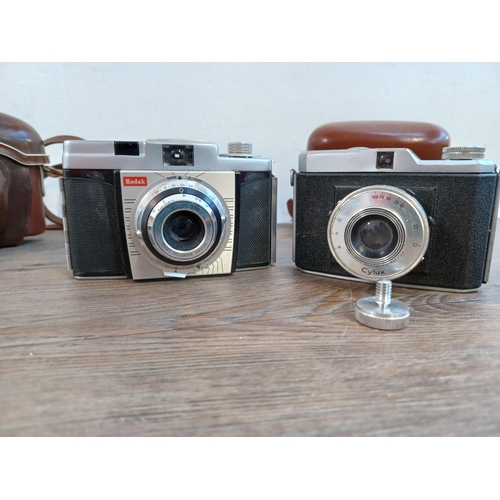 669 - Five 35mm cameras to include cased mid 1950s Zeiss Ikon Contina Ib fitted with Novicar-Anastigmat 1:... 