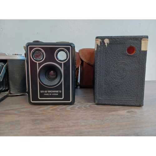 672 - Five box and folding cameras, one Agfa Isolette, three Kodak Brownie and one Vredeborch Slomexa