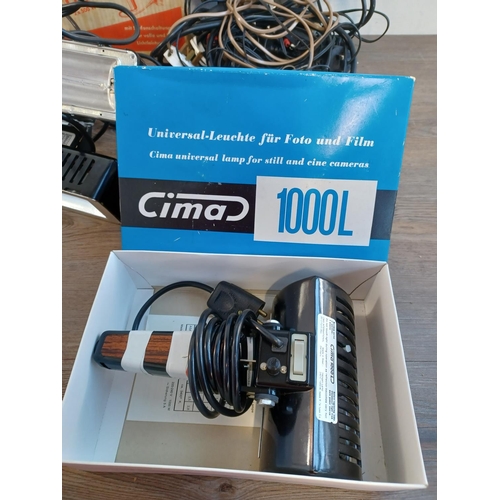 673 - A collection of items to include two boxed Cima 1000L universal lamps for still and cine cameras, bo... 