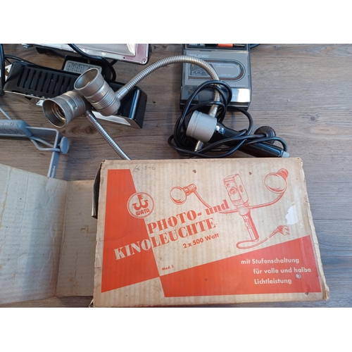 673 - A collection of items to include two boxed Cima 1000L universal lamps for still and cine cameras, bo... 