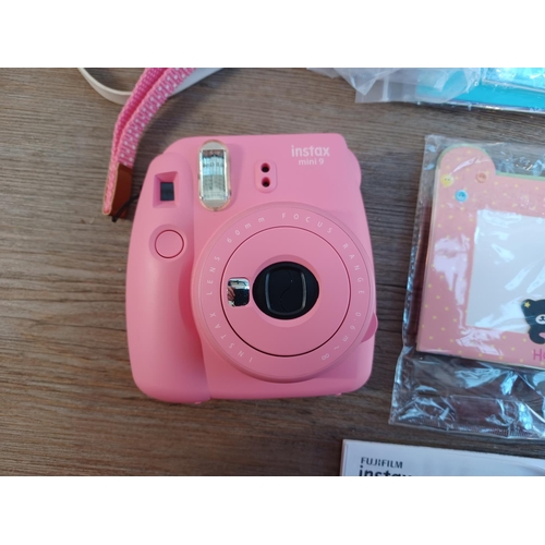 674 - A boxed and cased Fujifilm Instax Mini 9 instant camera for Fuji Instax Mini film with close-up lens... 