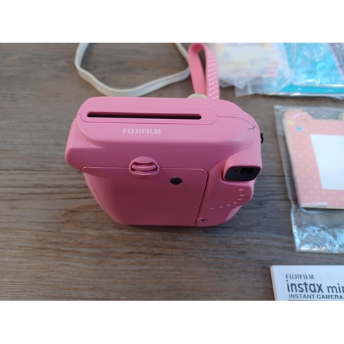 674 - A boxed and cased Fujifilm Instax Mini 9 instant camera for Fuji Instax Mini film with close-up lens... 