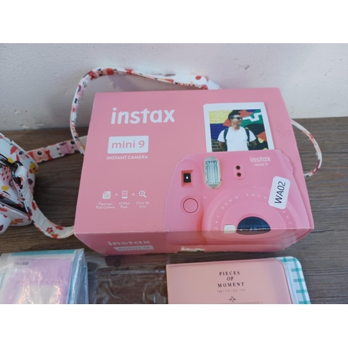 674 - A boxed and cased Fujifilm Instax Mini 9 instant camera for Fuji Instax Mini film with close-up lens... 