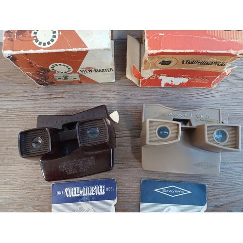 675 - Two boxed Sawyer's View-Master viewers with a selection of reels