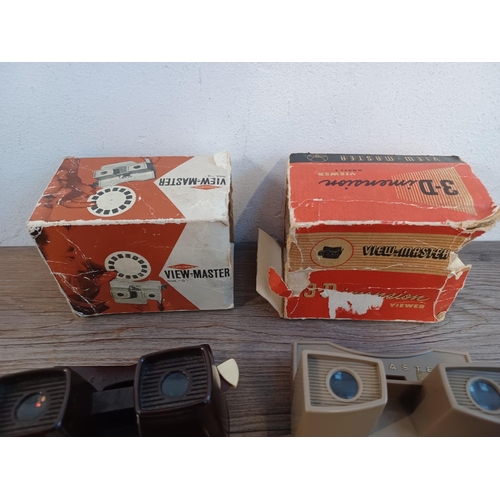 675 - Two boxed Sawyer's View-Master viewers with a selection of reels