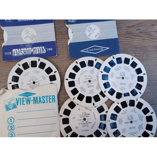 675 - Two boxed Sawyer's View-Master viewers with a selection of reels