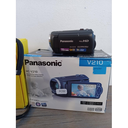 676 - Four HD digital camcorders, one boxed Polaroid DVG-720E, one JVC Everio, one Panasonic HC-V210 10mp ... 