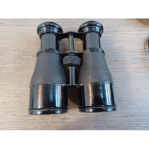 677 - Two cased pairs of binoculars, one WWI era French marked with altered/disguised military broad arrow... 