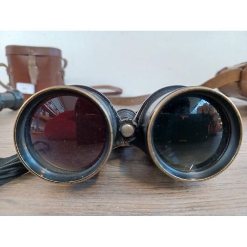 677 - Two cased pairs of binoculars, one WWI era French marked with altered/disguised military broad arrow... 