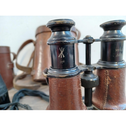 677 - Two cased pairs of binoculars, one WWI era French marked with altered/disguised military broad arrow... 