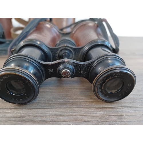 677 - Two cased pairs of binoculars, one WWI era French marked with altered/disguised military broad arrow... 