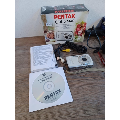 678 - Two boxed cameras with instruction manuals, one Pentax Optio M40 digital with accessories and one Ha... 