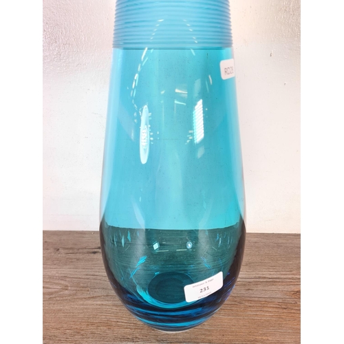 231 - A blue studio glass vase - approx. 38cm high