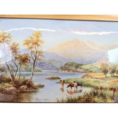 244 - A gilt framed hand painted porcelain plaque of Rydal Water signed to lower left - approx. 33cm wide ... 