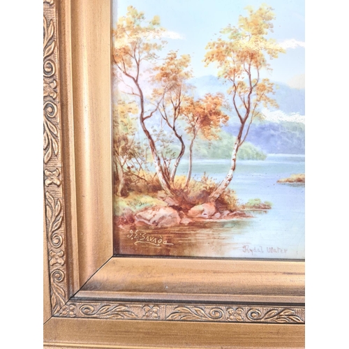 244 - A gilt framed hand painted porcelain plaque of Rydal Water signed to lower left - approx. 33cm wide ... 