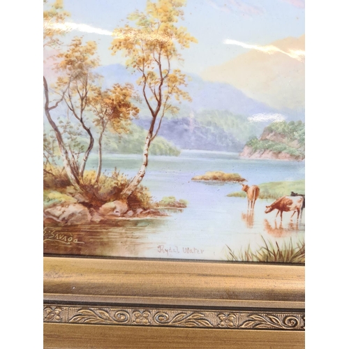 244 - A gilt framed hand painted porcelain plaque of Rydal Water signed to lower left - approx. 33cm wide ... 