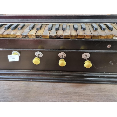 761 - A vintage Indian four stopper thirty-seven key harmonium reed organ