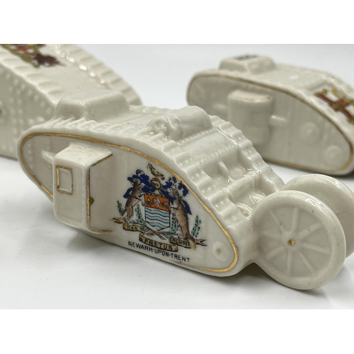 207 - Four crested china model tanks to include Grafton China City of Hereford, Shelley China Newark-Upon-... 