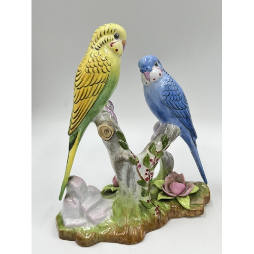 226 - Three ceramic budgerigar/parakeet figurines to include Goebel CV95, Staffordshire floral bone china ... 