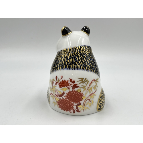 245 - A boxed Royal Crown Derby Panda paperweight with gold stopper