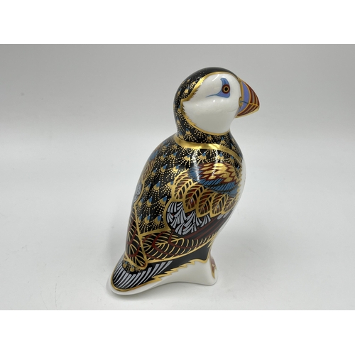 248 - A boxed Royal Crown Derby Puffin paperweight with gold stopper