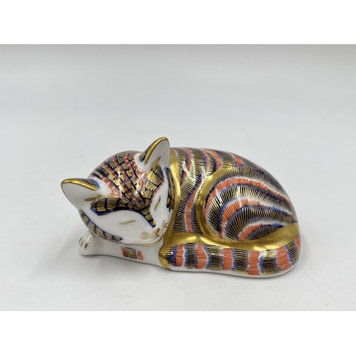 250 - A boxed Royal Crown Derby Sleeping Kitten paperweight with gold stopper