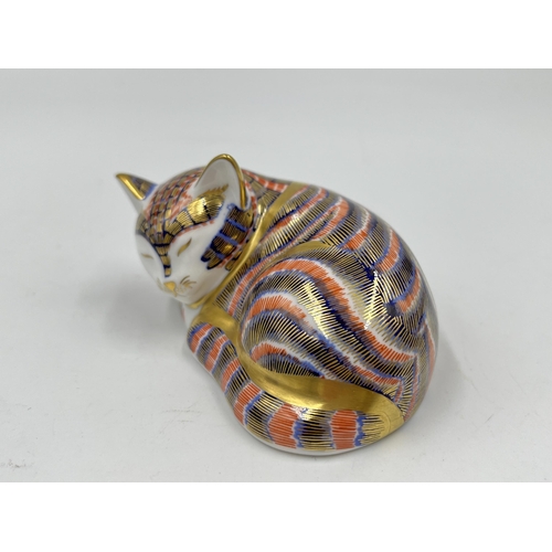 250 - A boxed Royal Crown Derby Sleeping Kitten paperweight with gold stopper