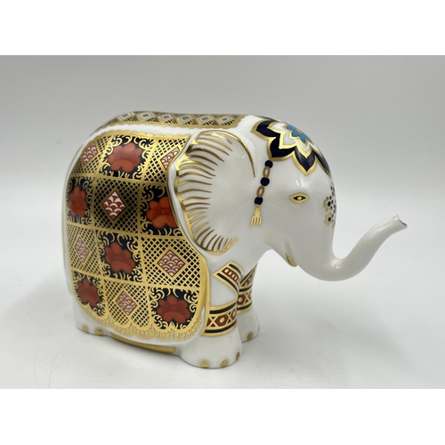 253 - A boxed Royal Crown Derby Elephant paperweight with gold stopper